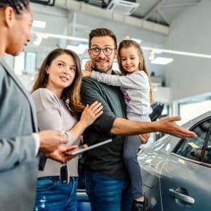 Sleek flooring accentuating luxury cars in a Chicagoland dealership showroom.