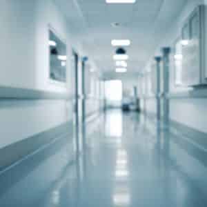 Pristine epoxy-coated floor in a hospital hallway ensuring safety and hygiene.