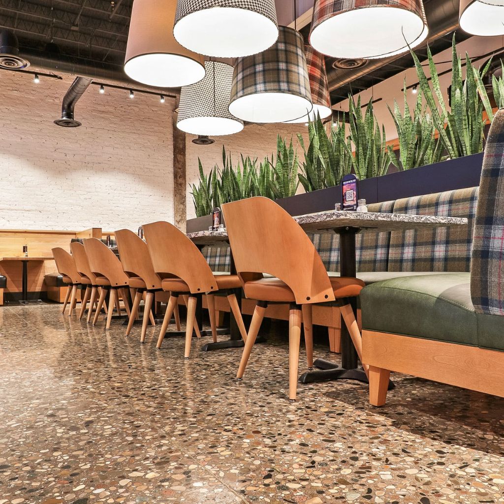 Reflective grind and seal concrete floor in a contemporary restaurant setting.