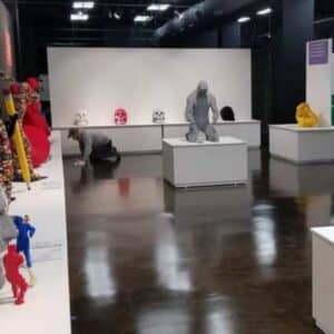 Rich brown polished concrete floor in a contemporary art gallery.